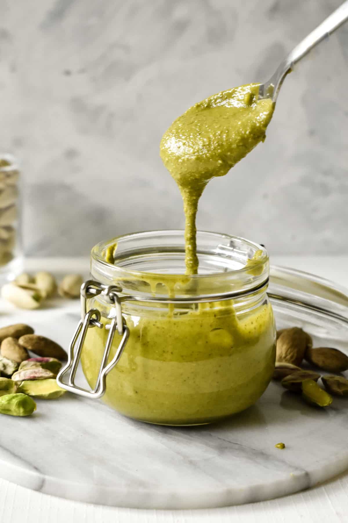 nut butter being drizzled with a spoon