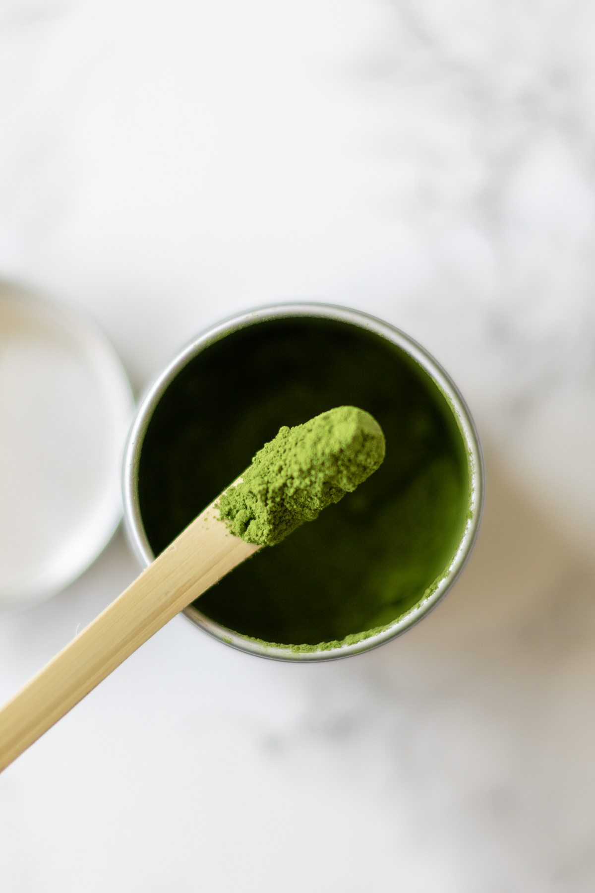 a pot of matcha green tea powder