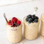 some jars of overnight oats topped with berries
