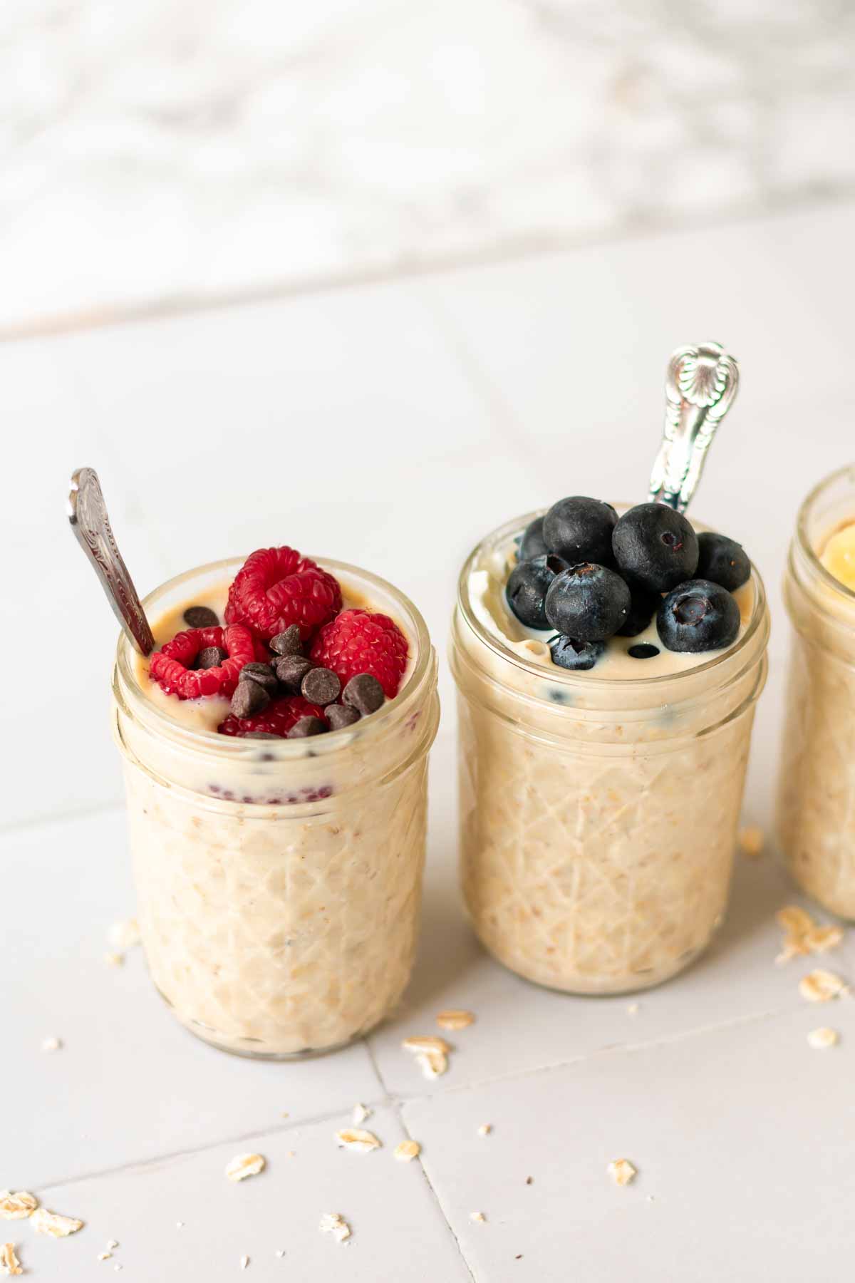 some jars of overnight oats topped with berries