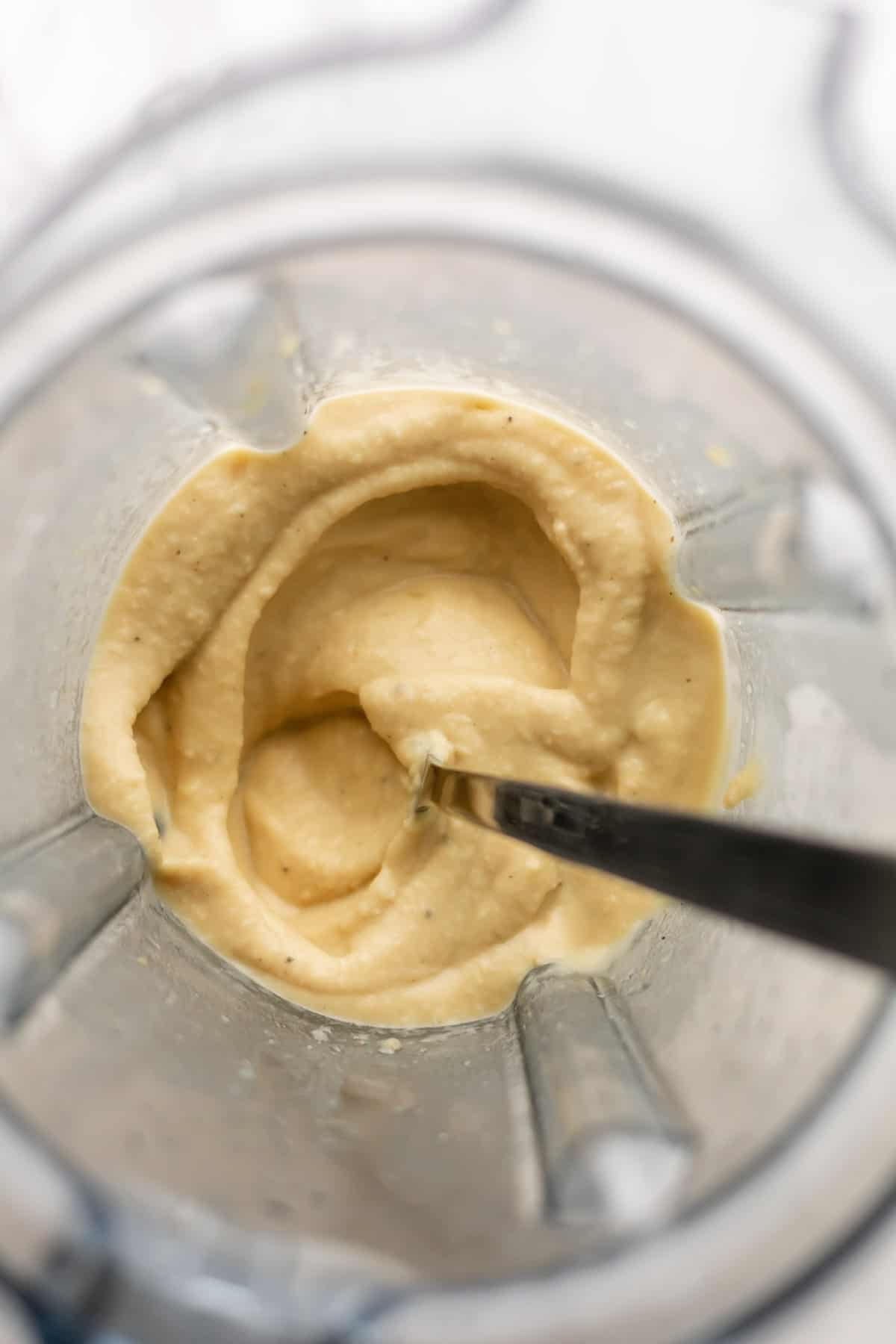 creamy blended hummus in a blender