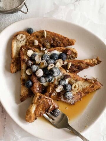 French toast being dug into with a fork