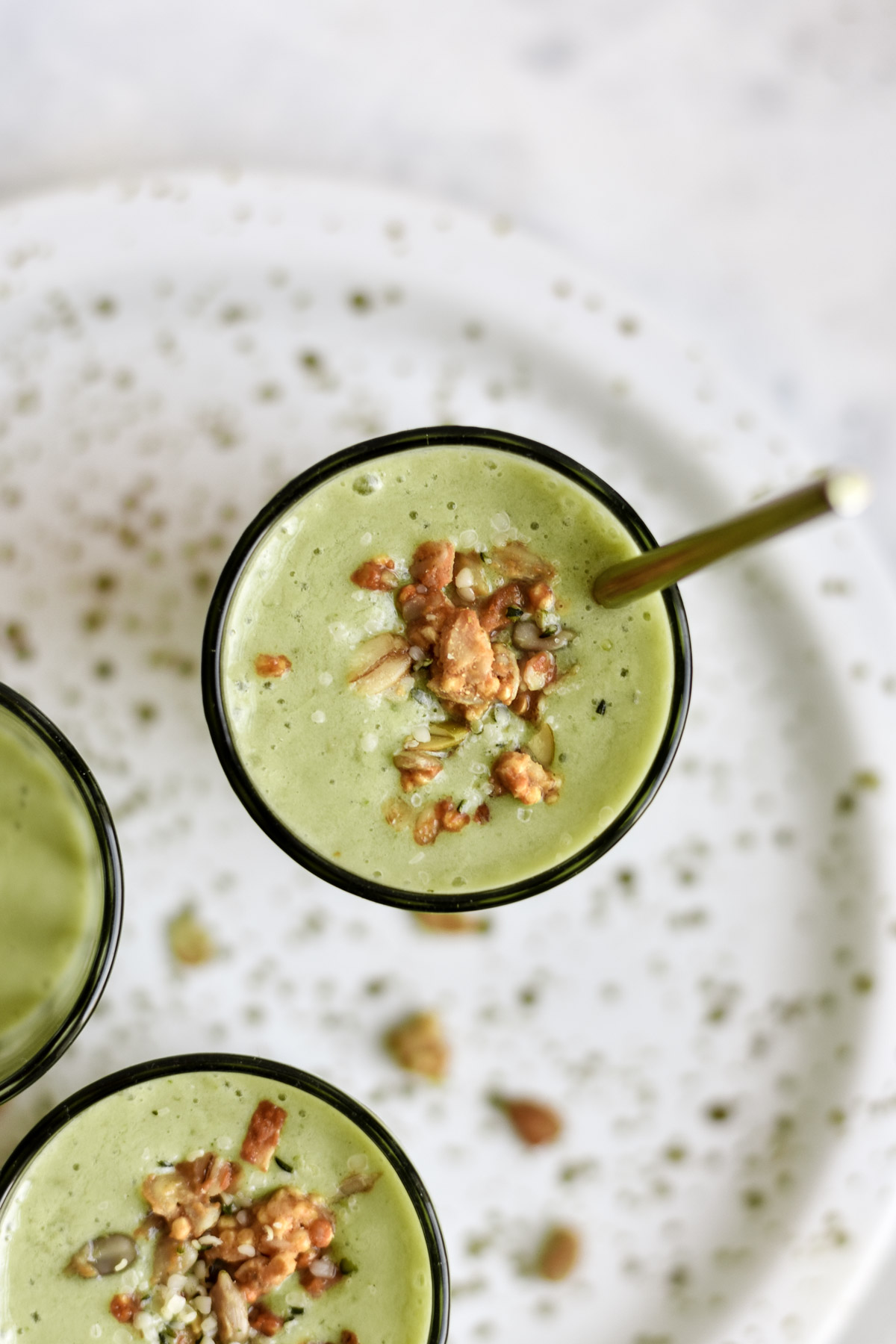 a green smoothie topped with granola