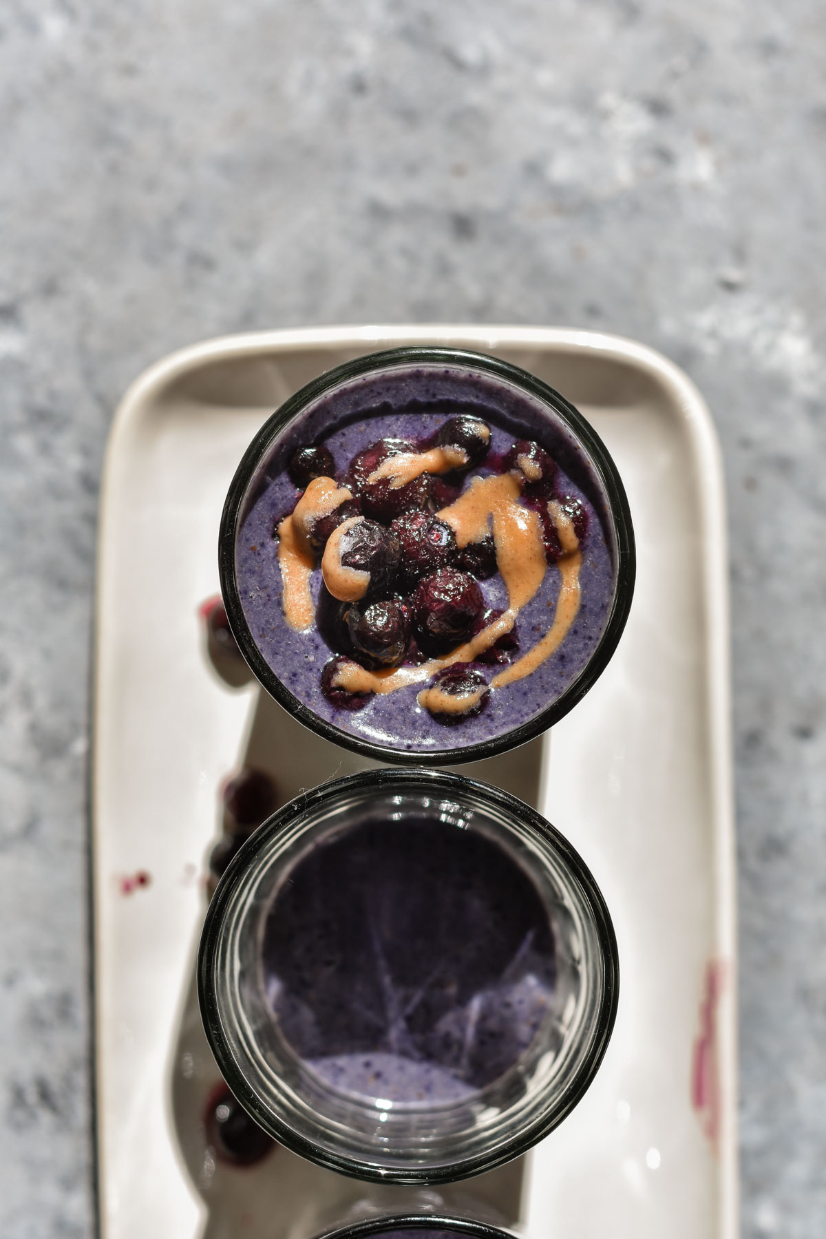 two glasses of blueberry smoothie