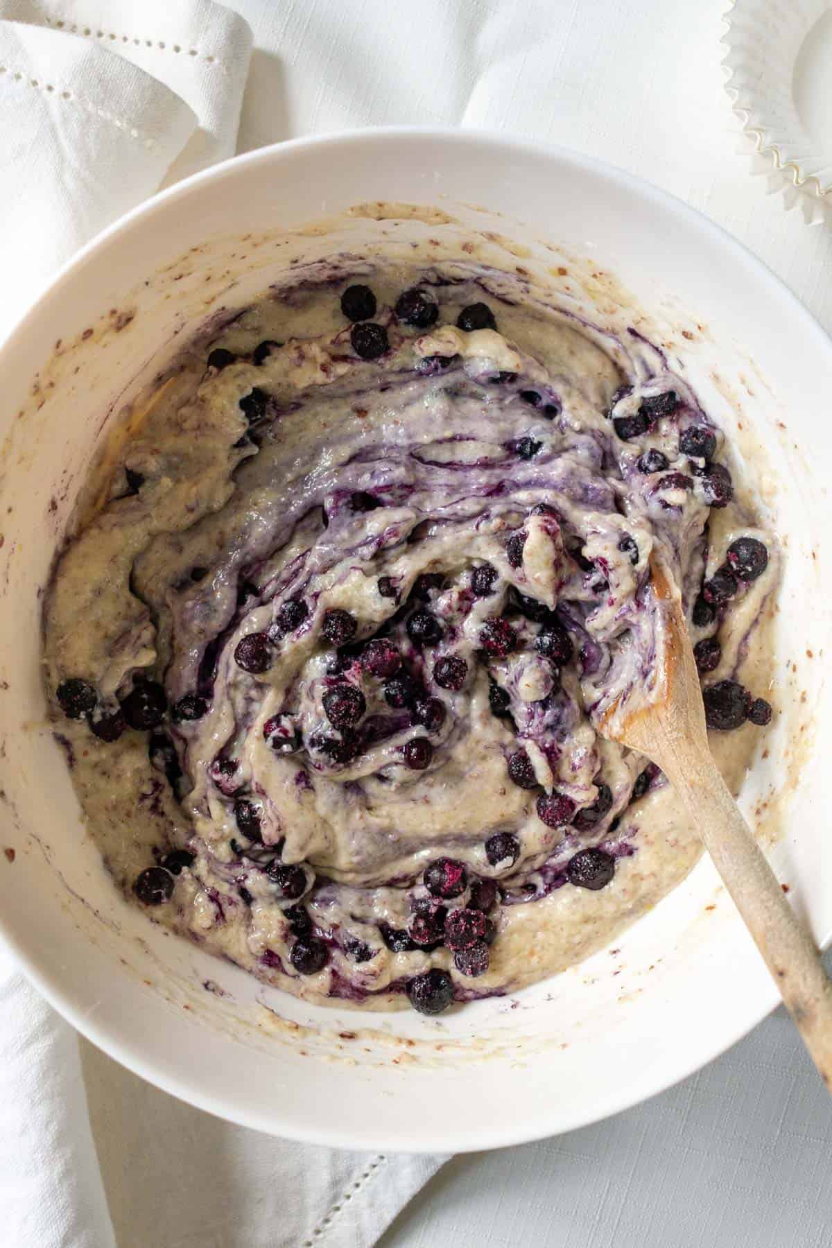 blueberries swirled into muffin batter