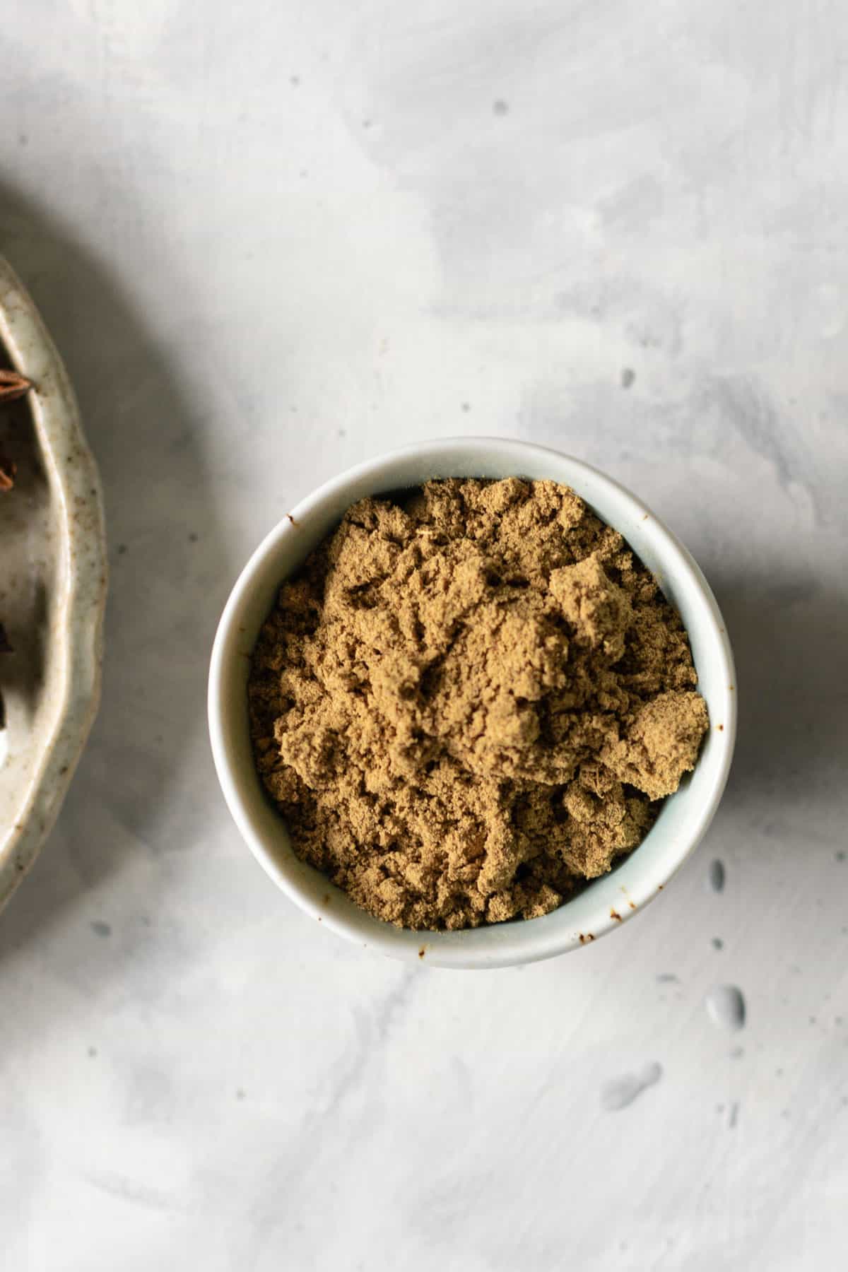 a small bowl of ground up chai masala