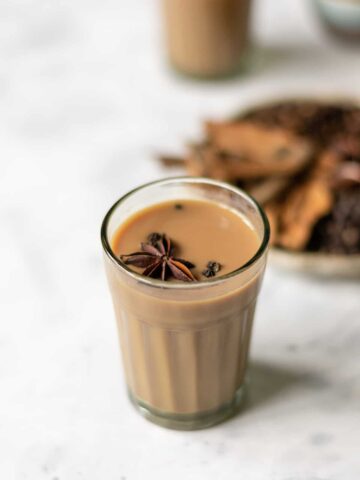 a glass filled with hot masala chai