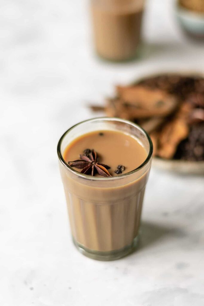 a glass filled with hot masala chai