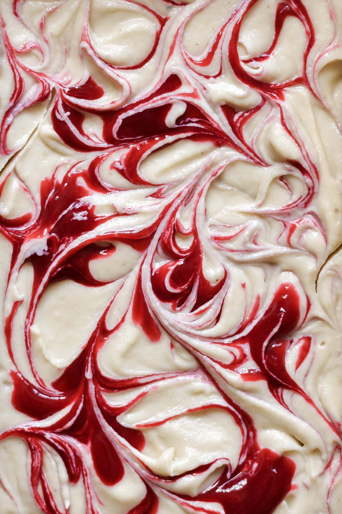 strawberry sauce swirled through cheesecake filling