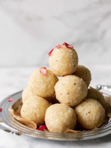 coconut ladoo stacked on top of each other