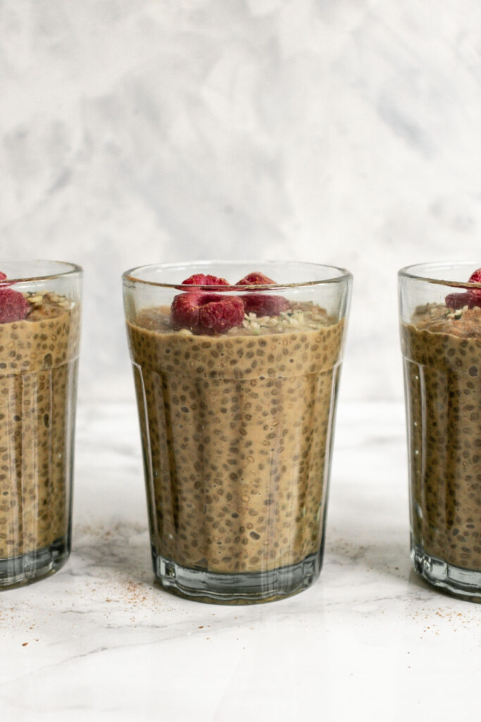 three jars of chia pudding in a row