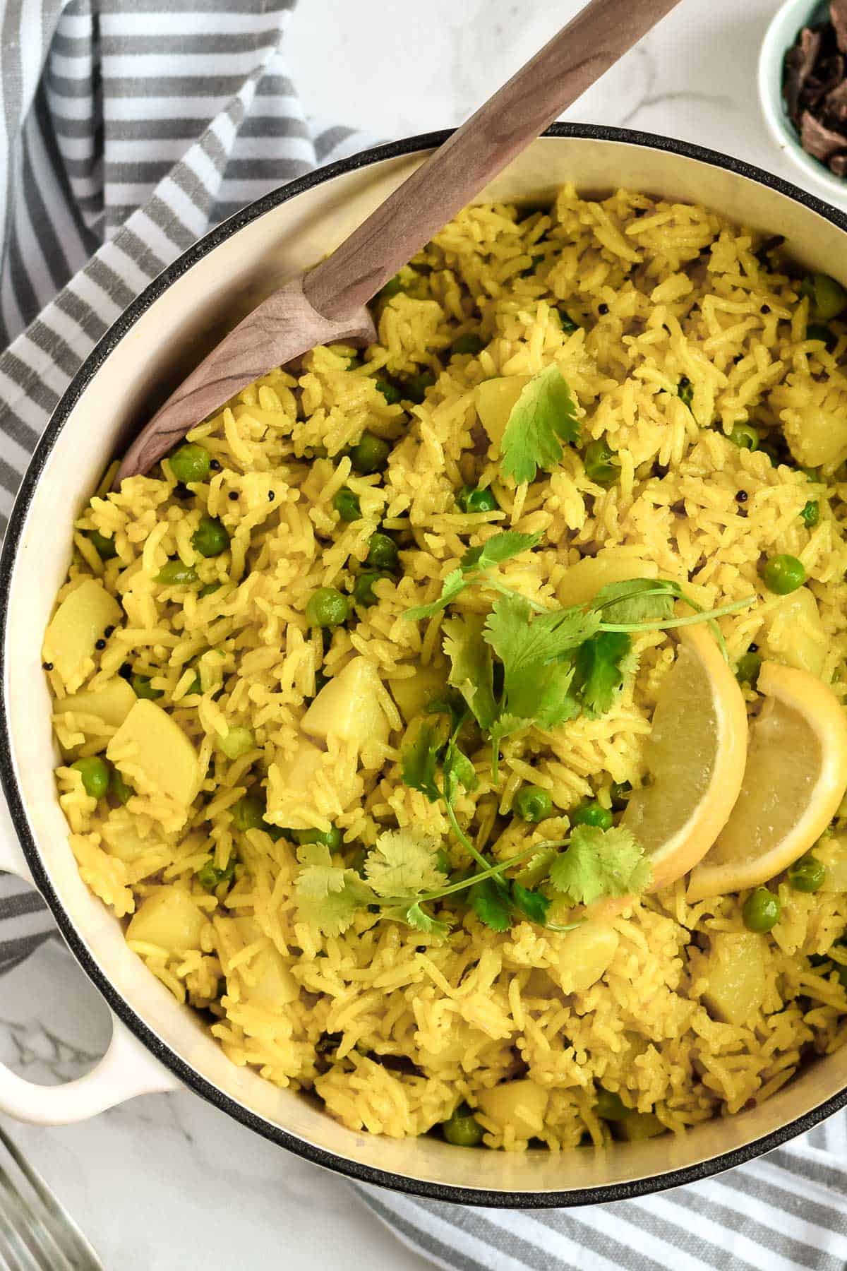 yellow pilau rice with peas and potatoes