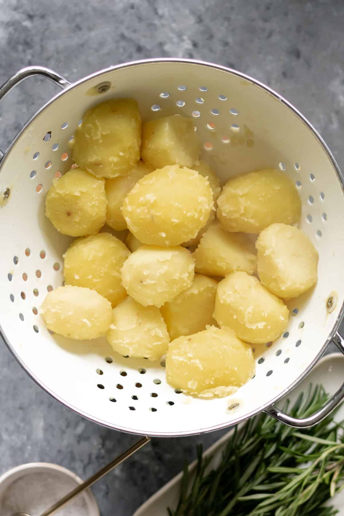 boiled potatoes swished in a colander
