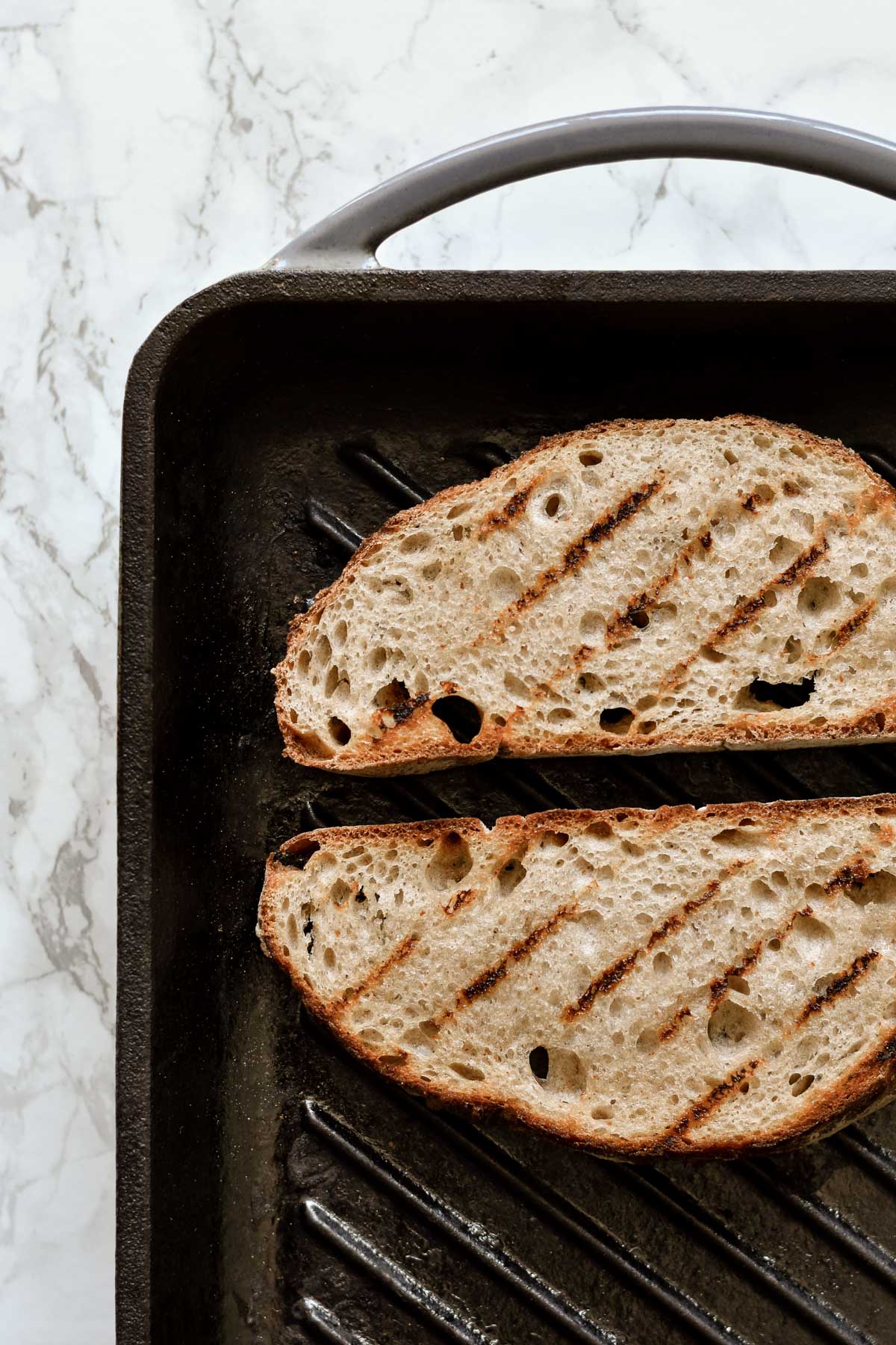 grilled sourdough bread on a pan