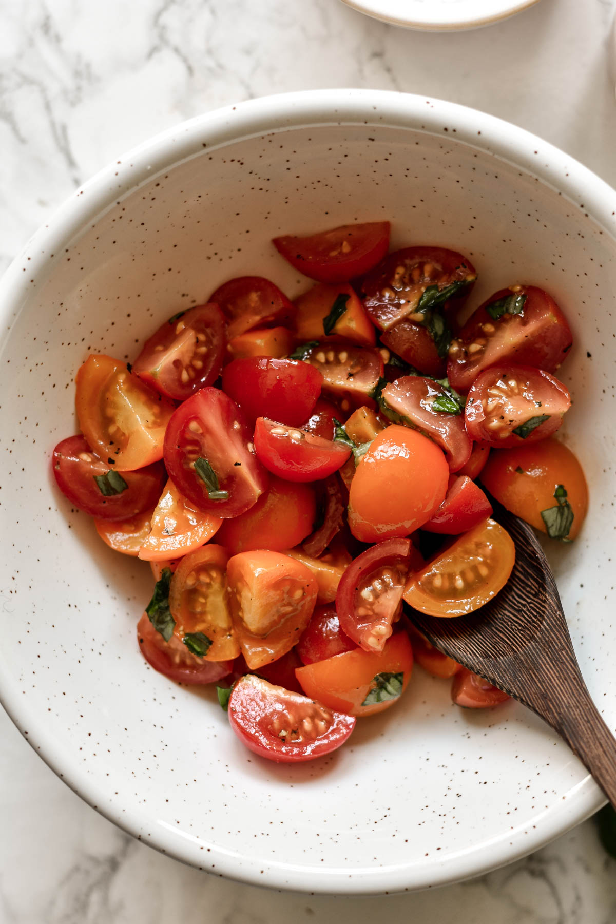 a bowl of marinated cherry tomatoes