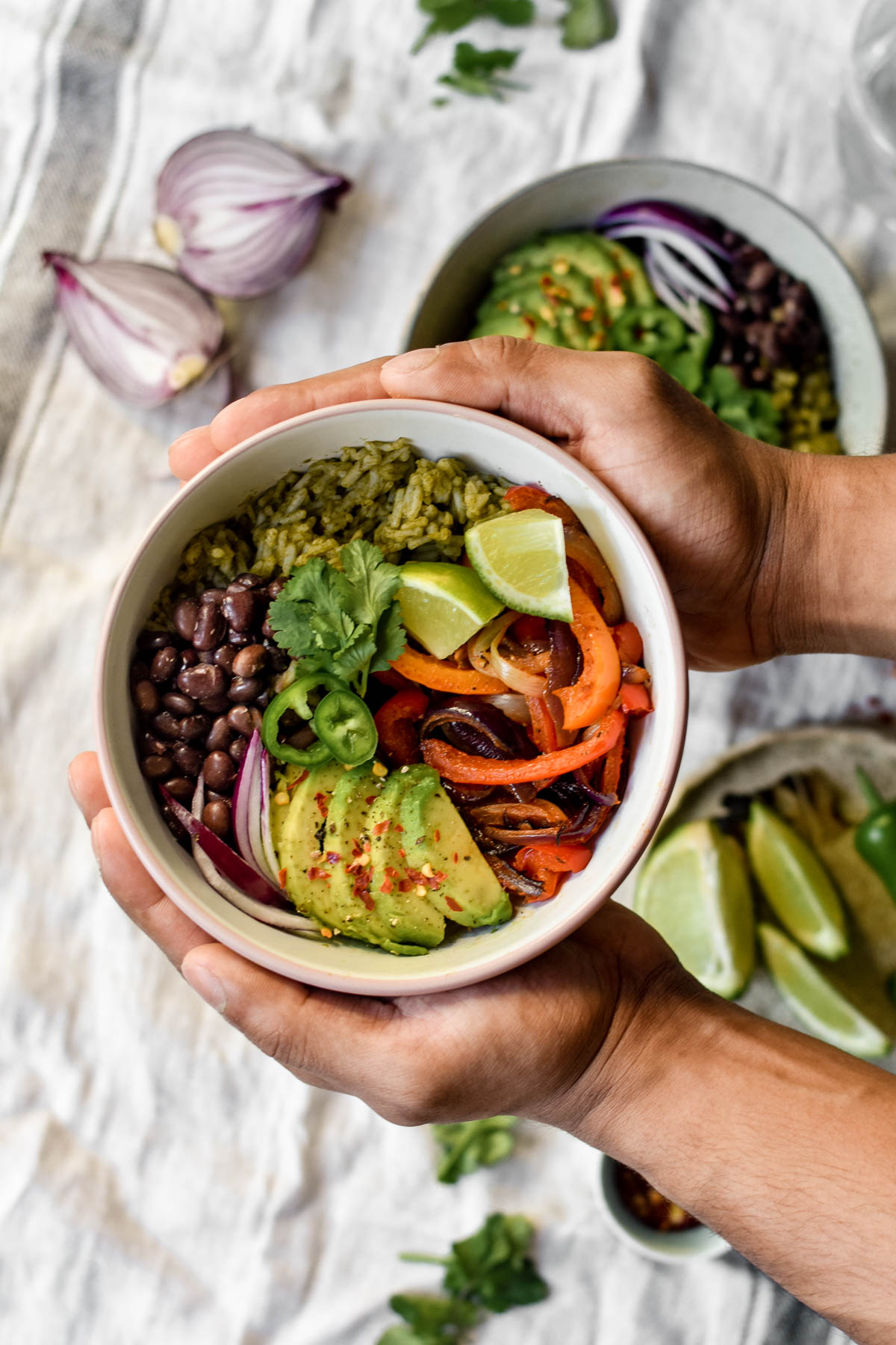 a burrito bowl being held up