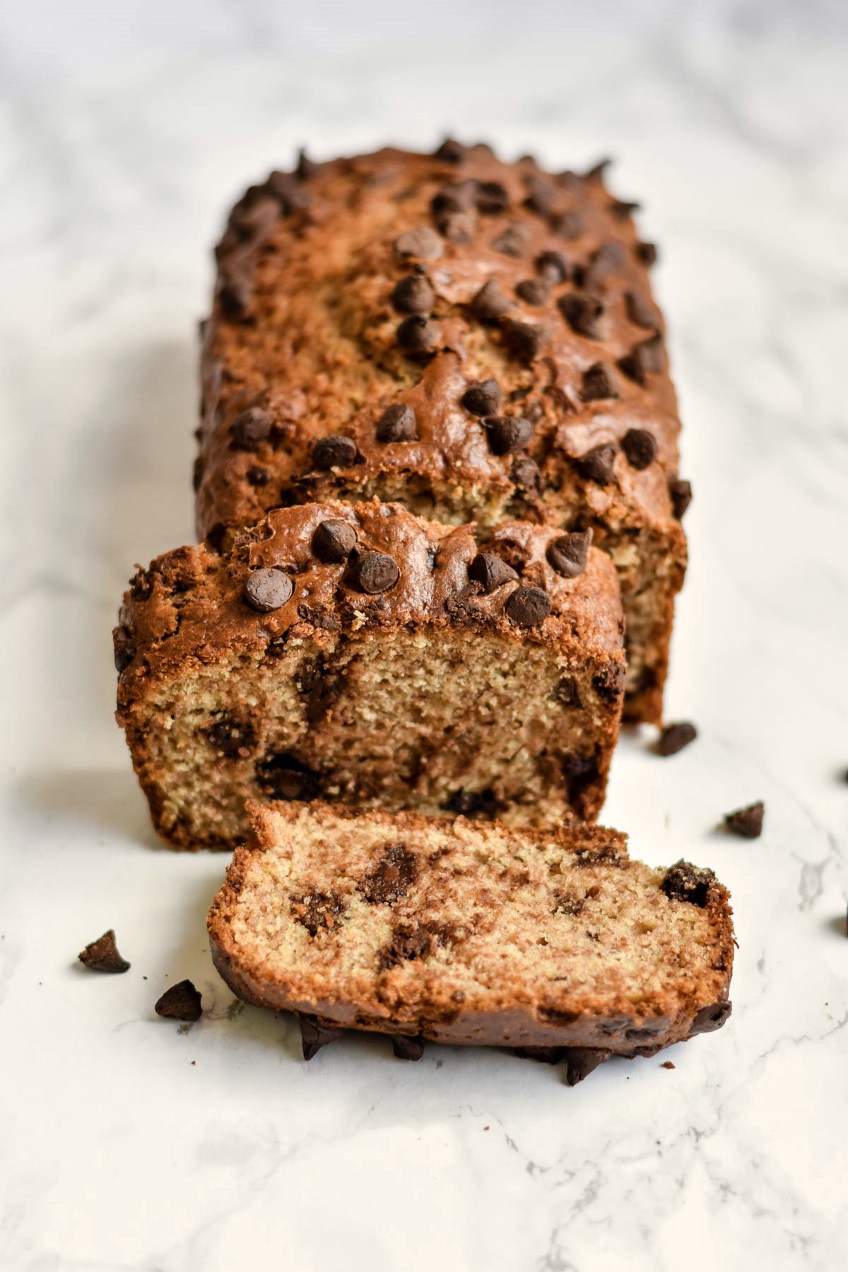a loaf of chocolate chip banana bread cut into slices