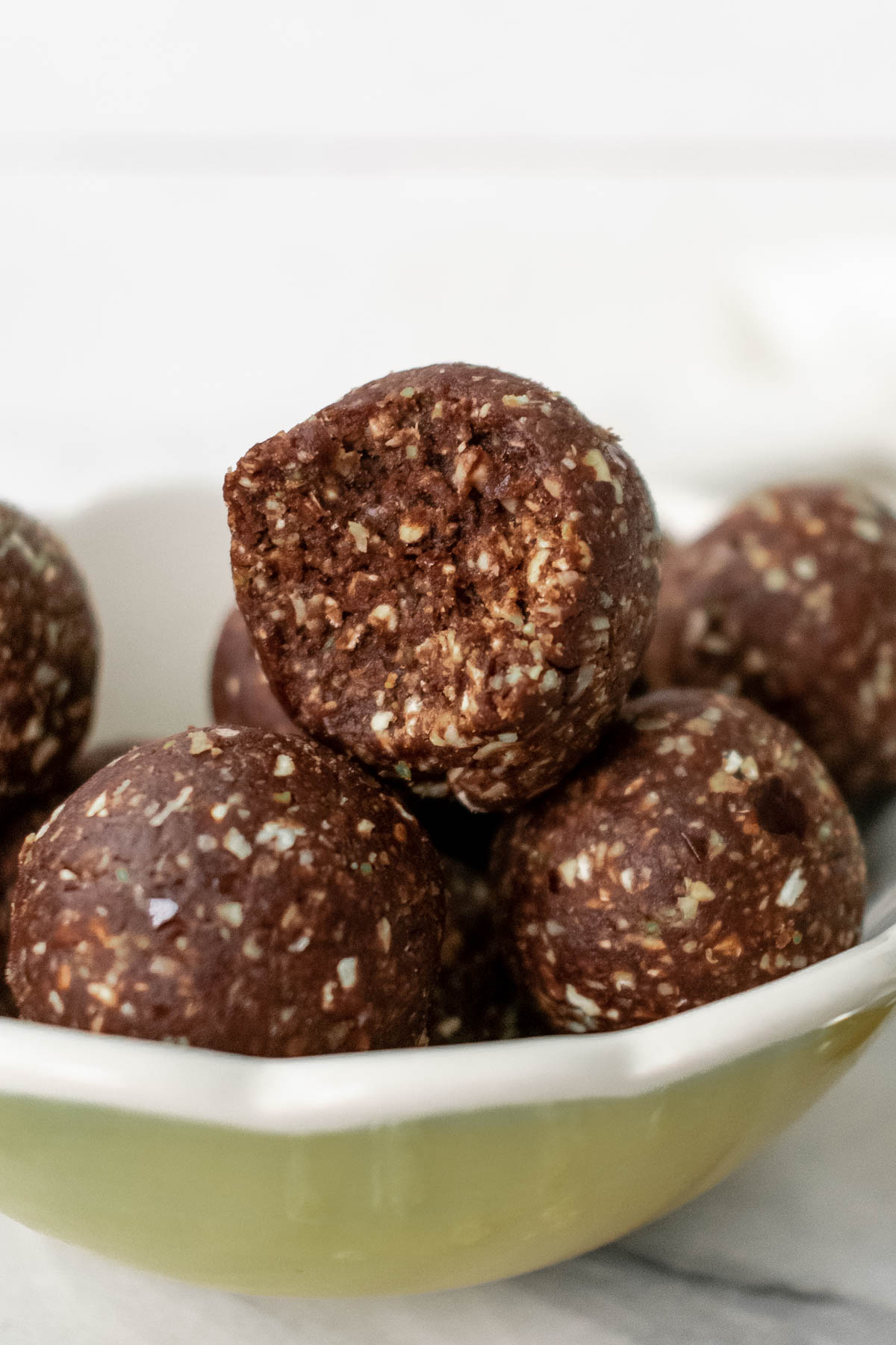 energy balls piled into a bowl