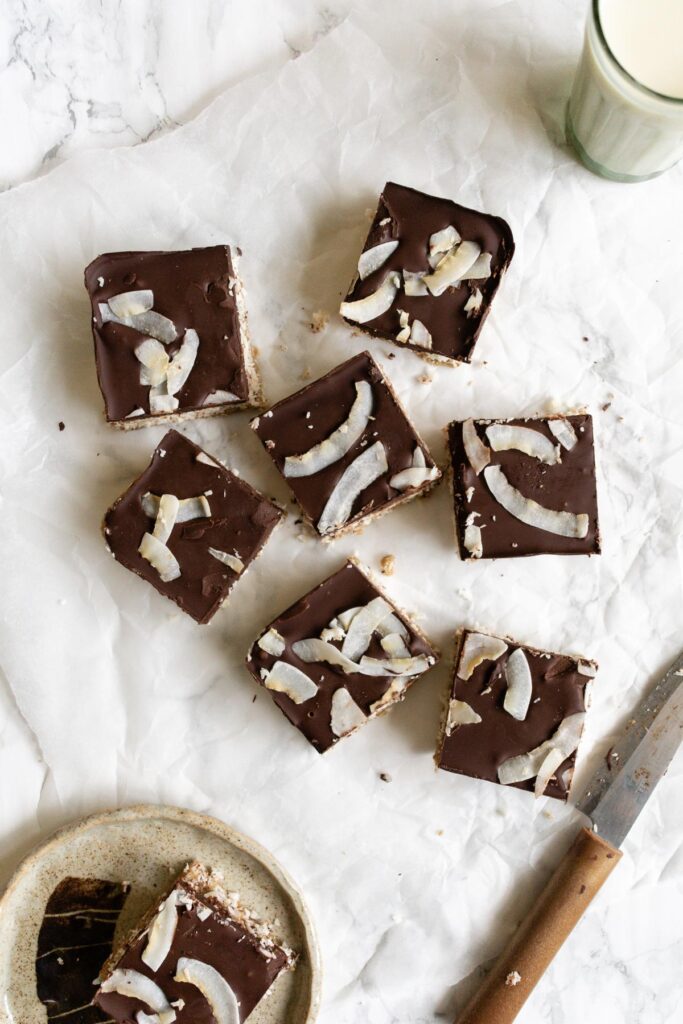squares of chocolate-topped coconut bars