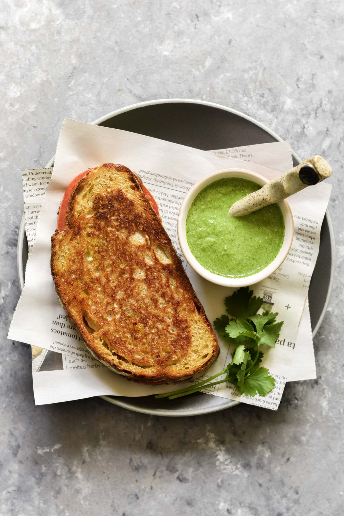 masala grilled cheese on a plate with coriander chutney