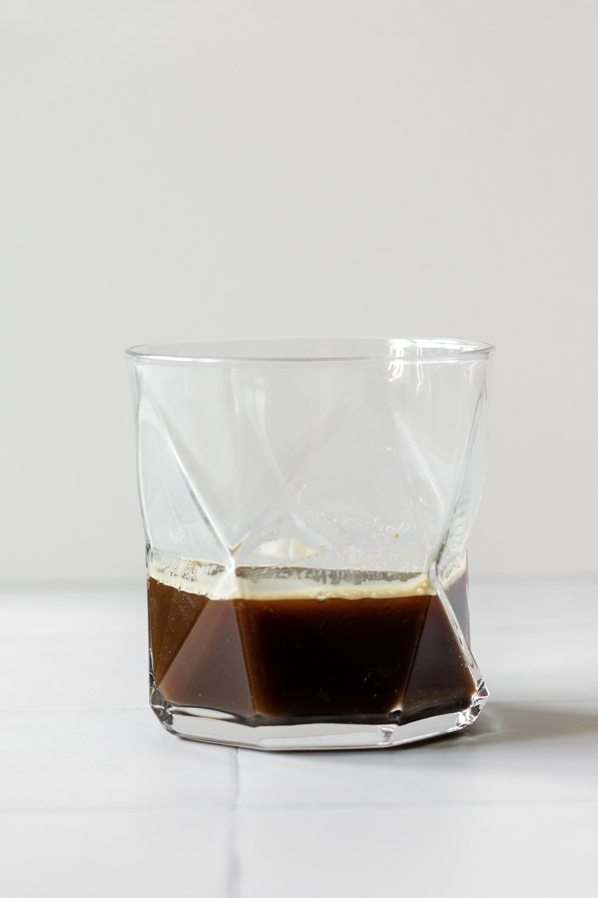 instant coffee mixed with water in a glass