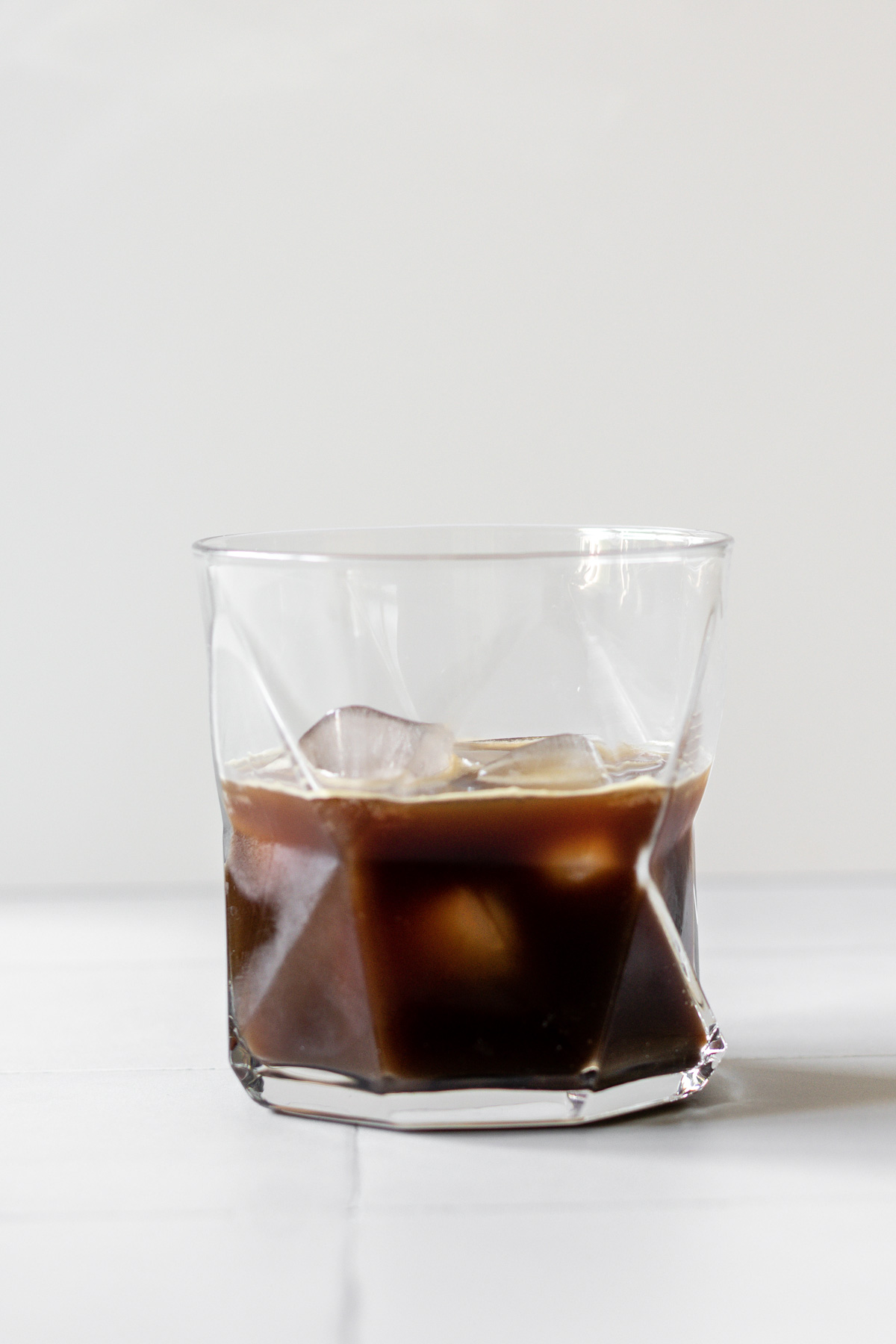 black coffee and ice in a glass