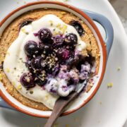 baked oats topped with yoghurt, blueberries and lemon zest