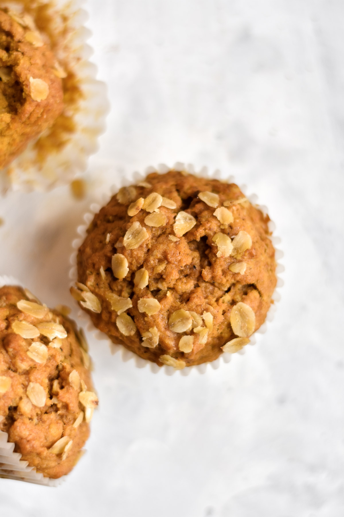 pumpkin spice muffins topped with oats
