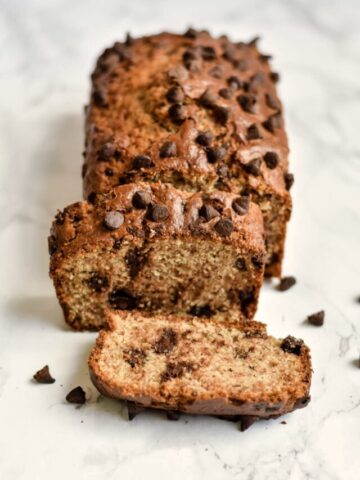 a loaf of chocolate chip banana bread cut into slices