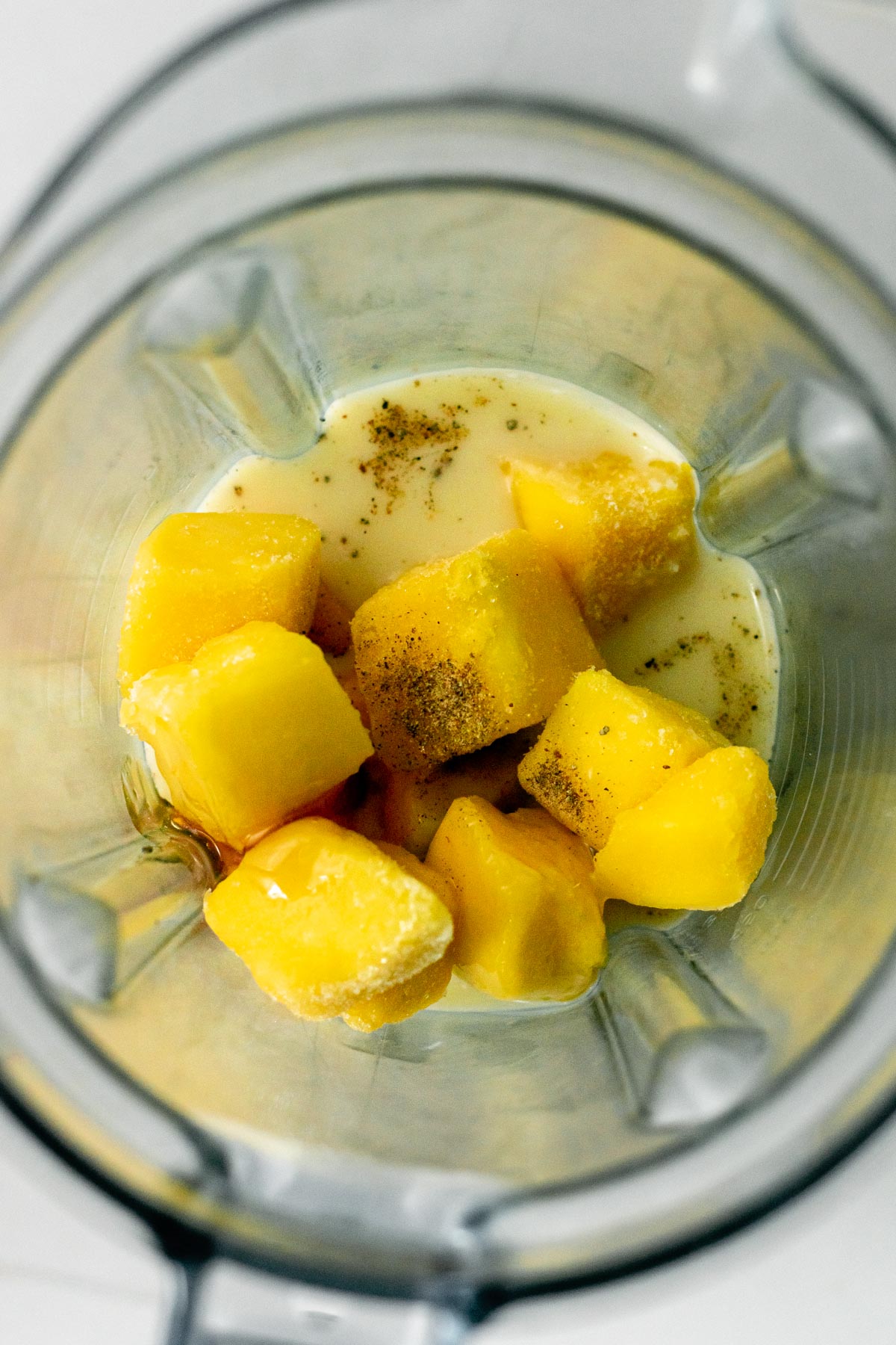 mango lassi ingredient in a blender