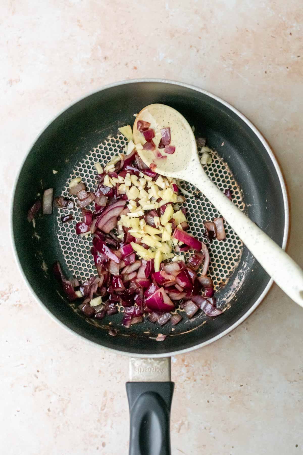 onions, garlic and ginger sauteeing in a pan