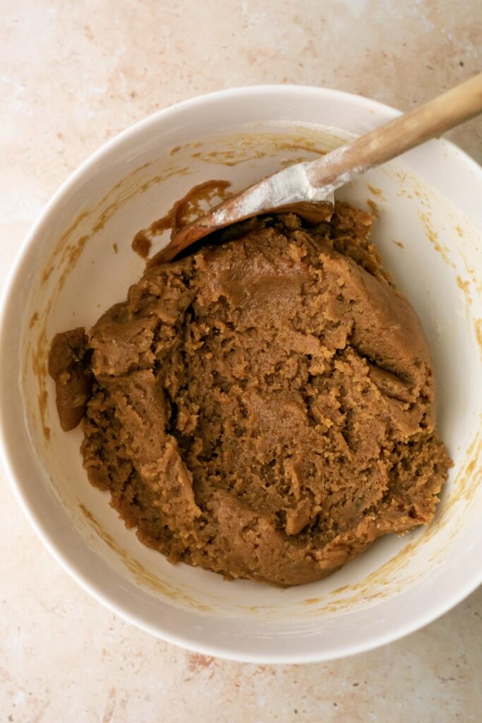 finished cookie dough batter in a mixing bowl