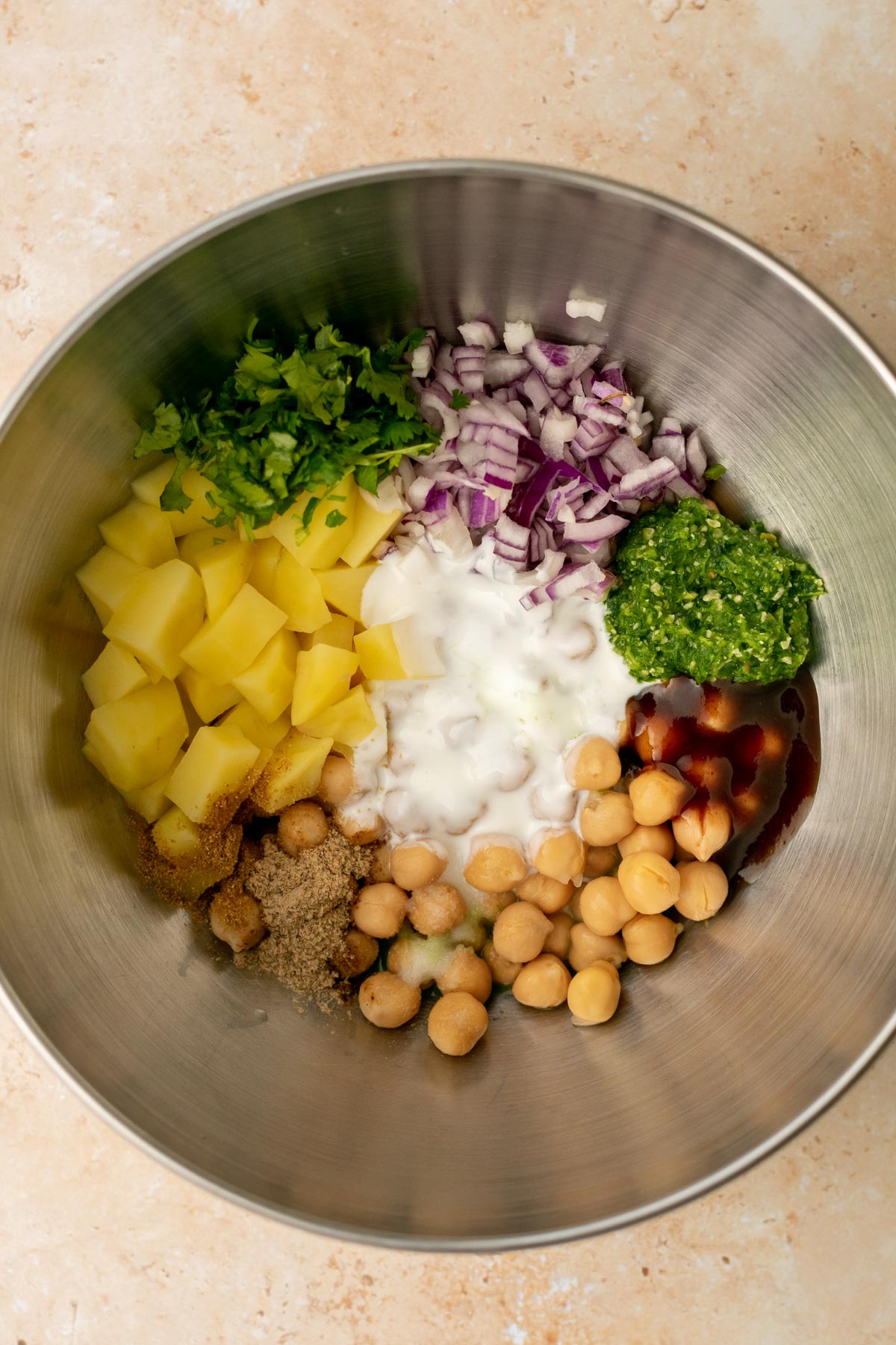 ingredients for aloo chana chaat in a bowl