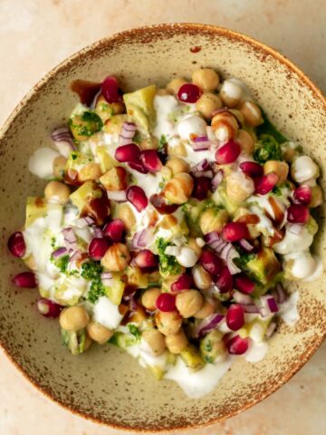 a bowl of chaat topped with pomegranate seeds