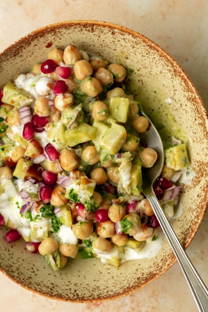 a bowl of chaat being enjoyed