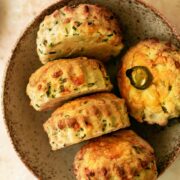a bowl containing cheese, chive and jalapeno scones