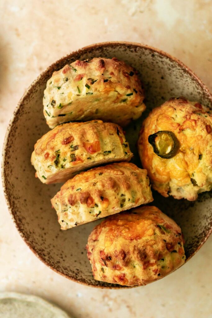 a bowl containing cheese, chive and jalapeno scones