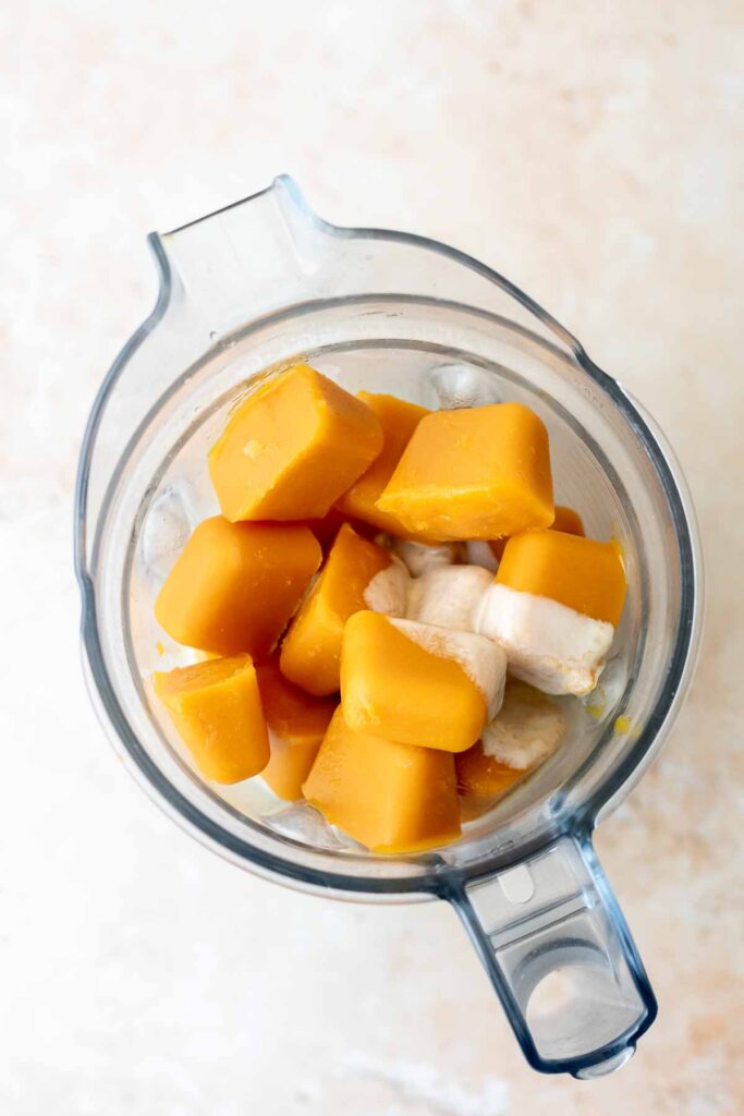 mango ice cream ingredients in a blender