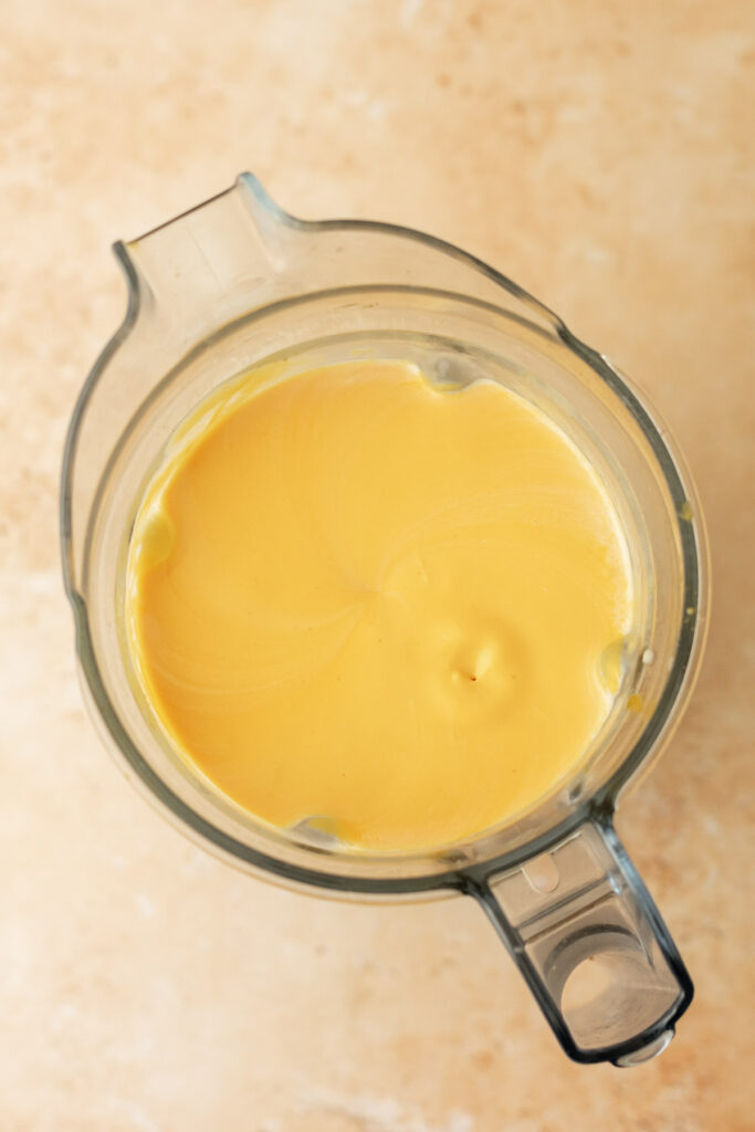 blended mango ice cream ready to be frozen