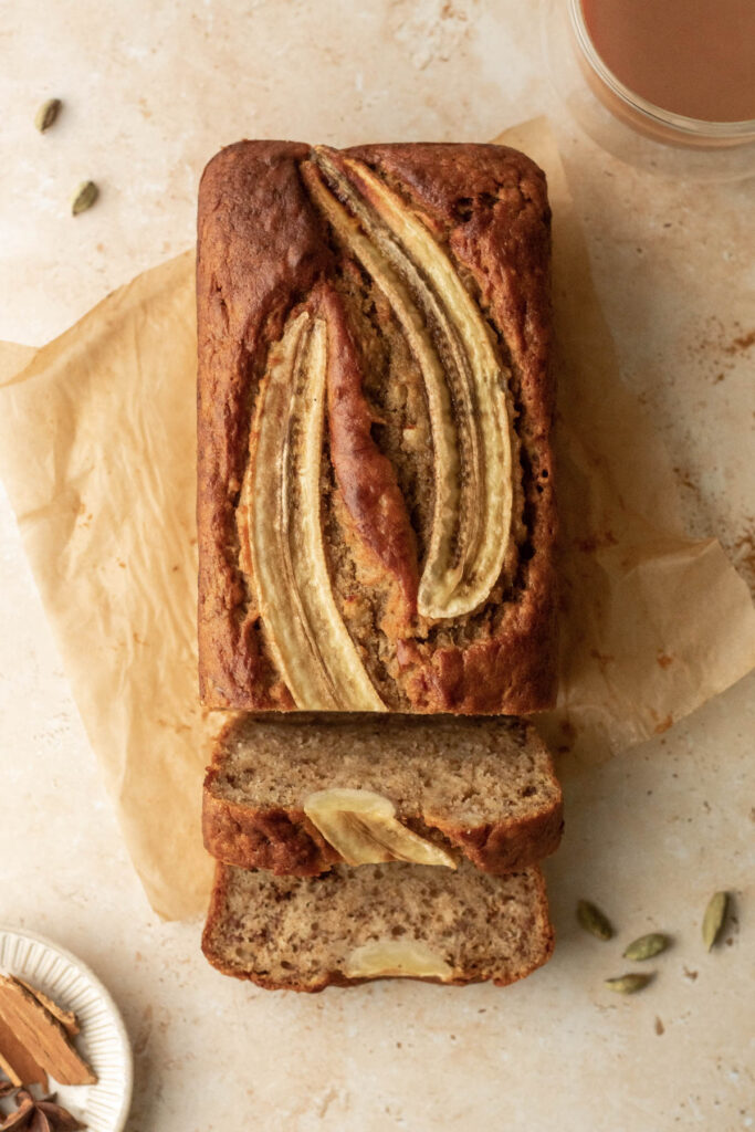 a loaf of banana bread with some slices already cut