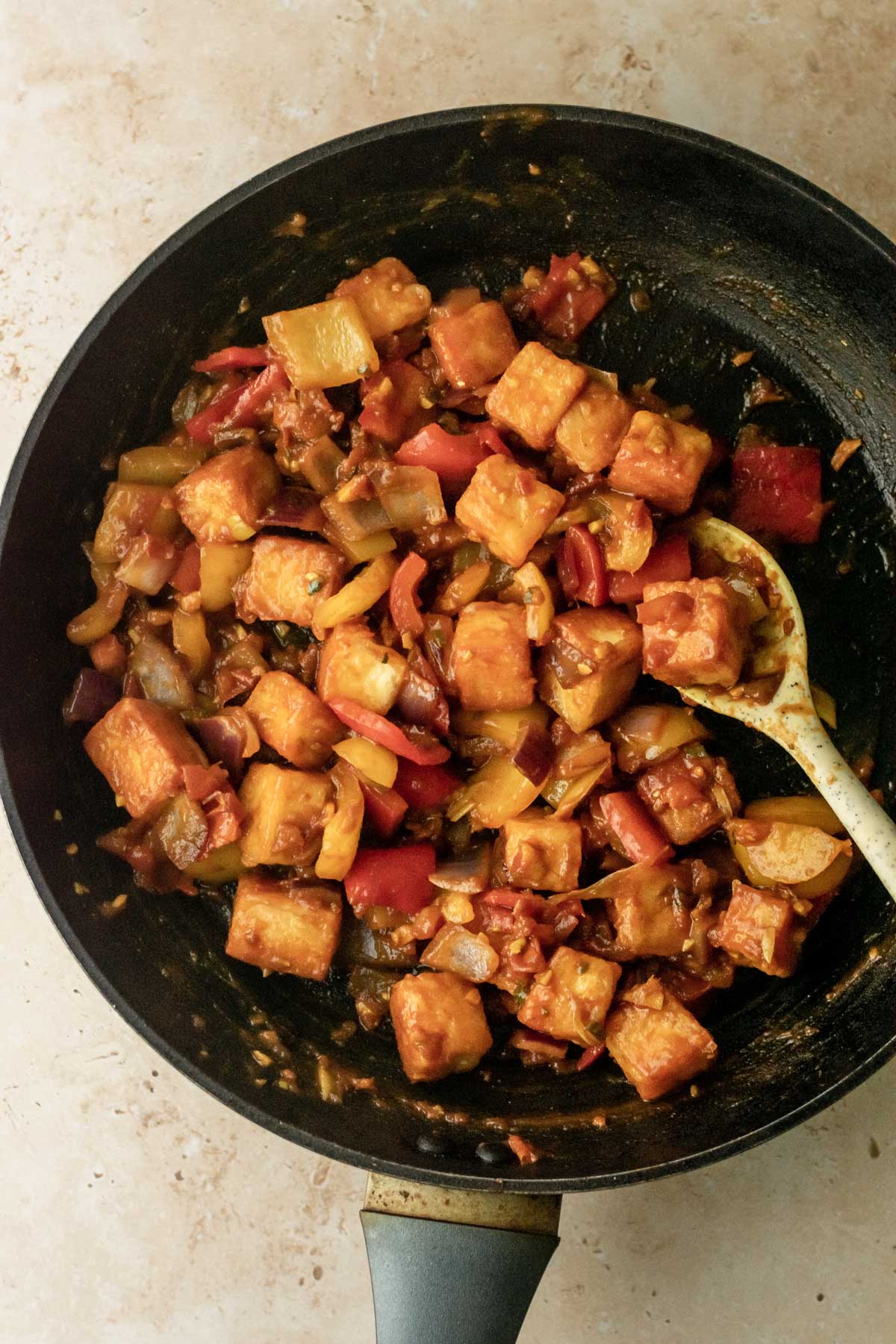 prepared chilli paneer in a frying pan ready to be enjoyed