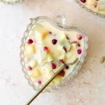 a bowl of custard with mixed fruits