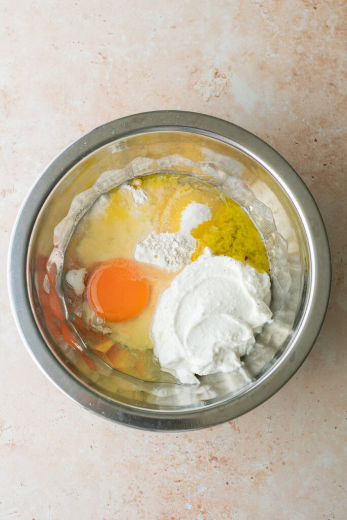 ingredients for cottage cheese pancakes in a mixing bowl