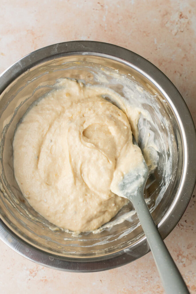 mixed pancake batter in a bowl with a spatula