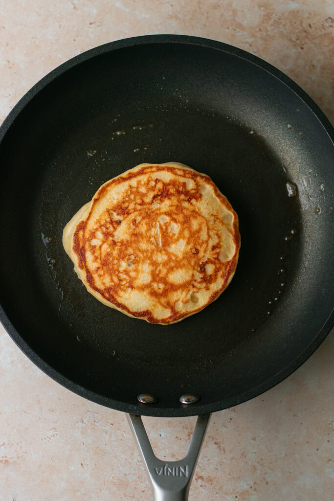 a golden pancake in a frying pan