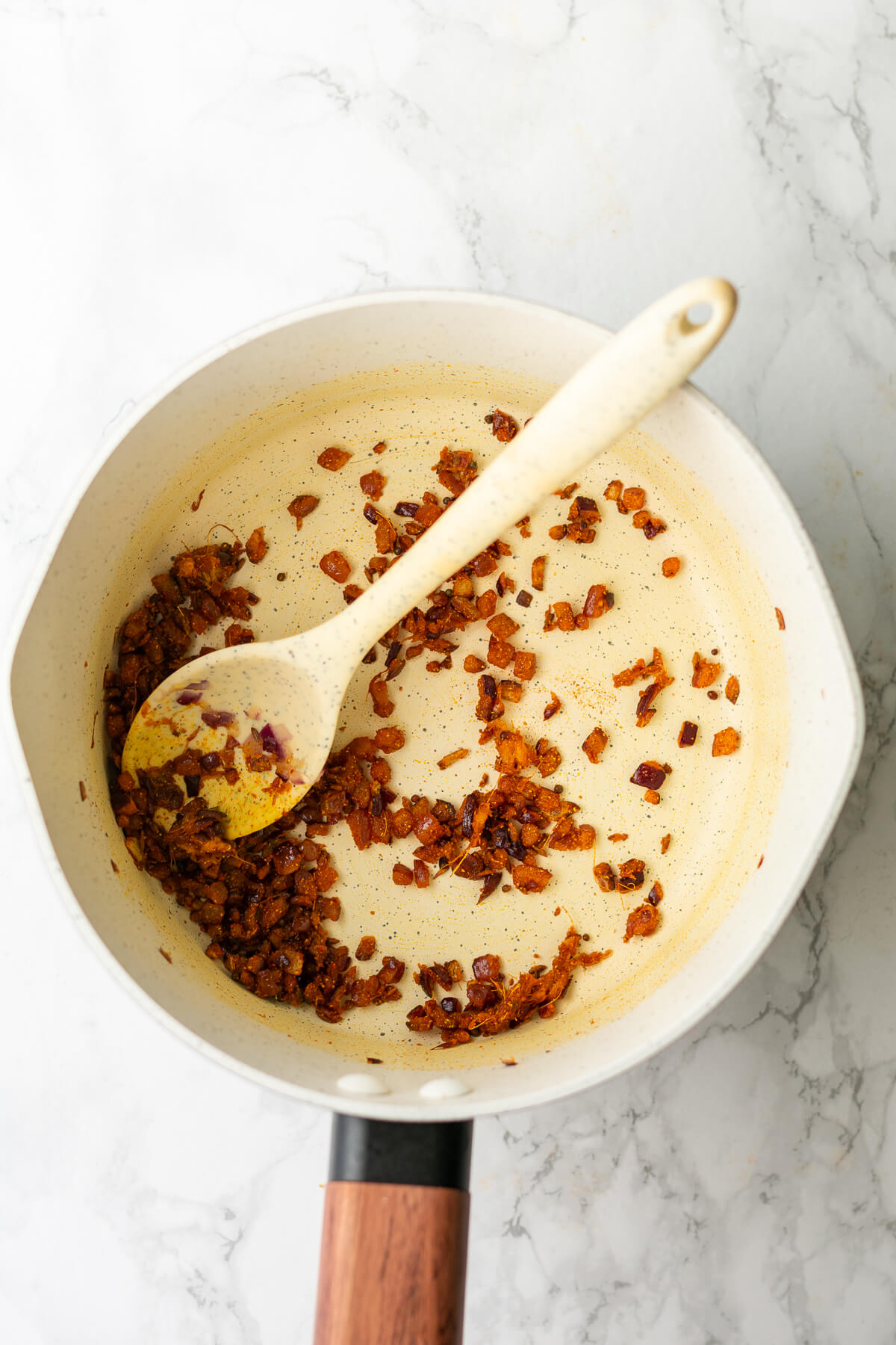 onions and spices mixed together in a pan