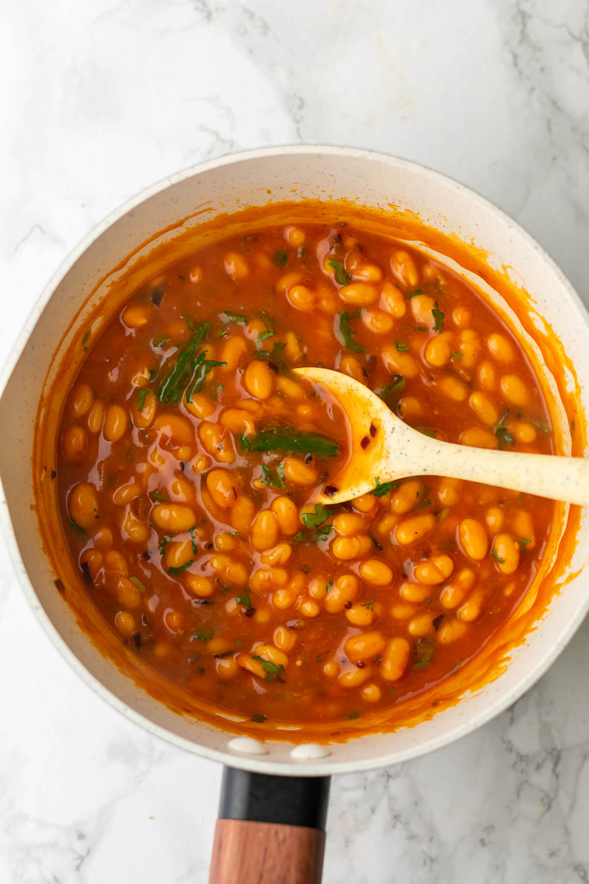 a pan of cooked masala beans ready to be eaten