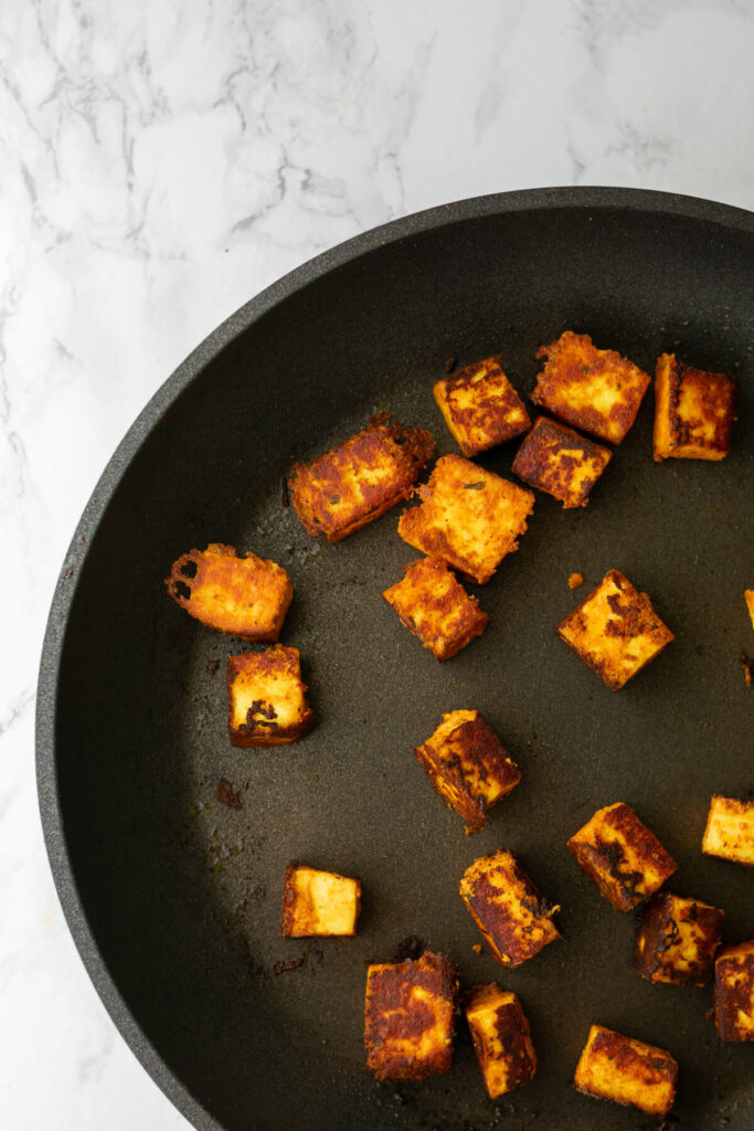 paneer tikka frying in a pan