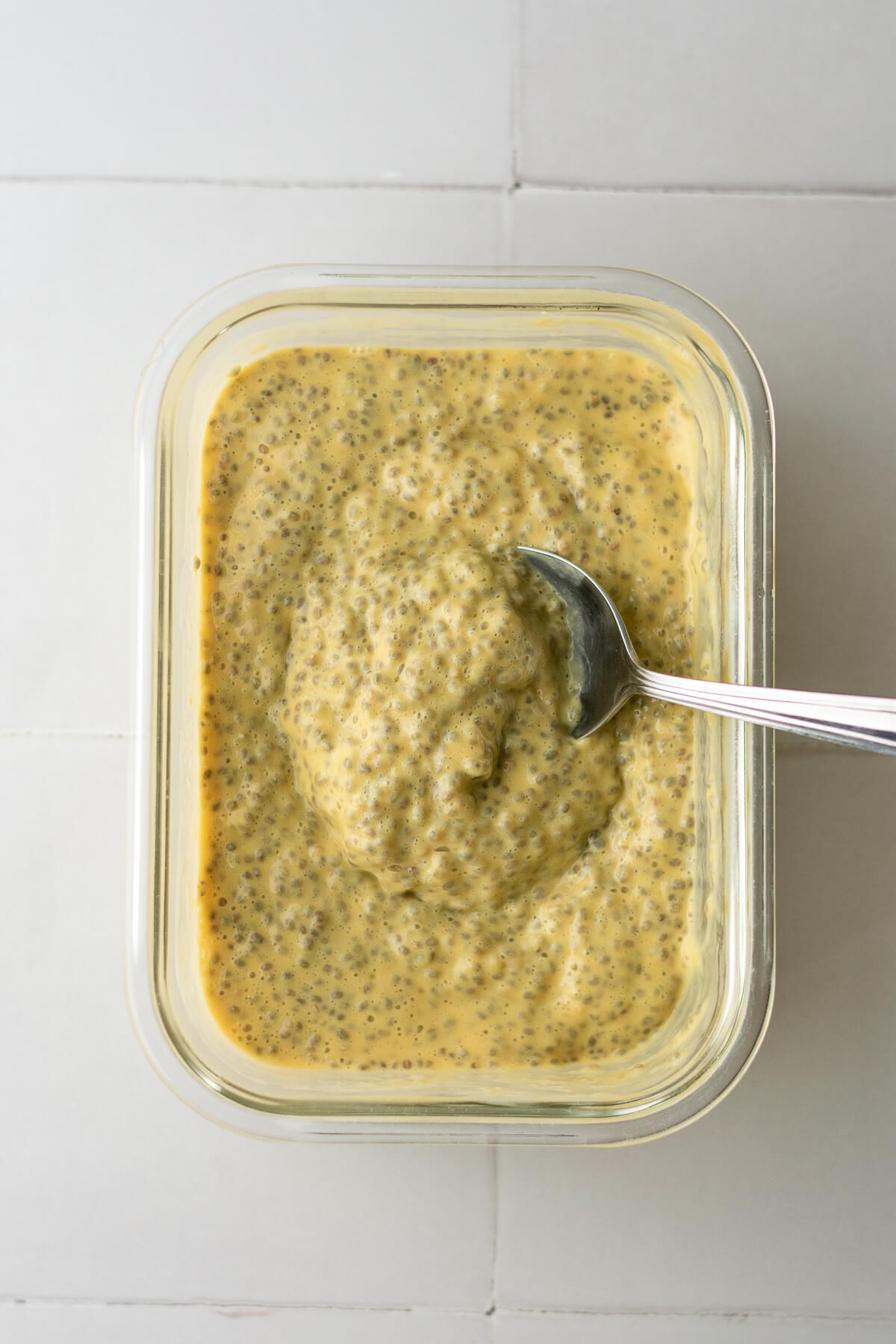 creamy mango chia pudding in a dish post refrigeration
