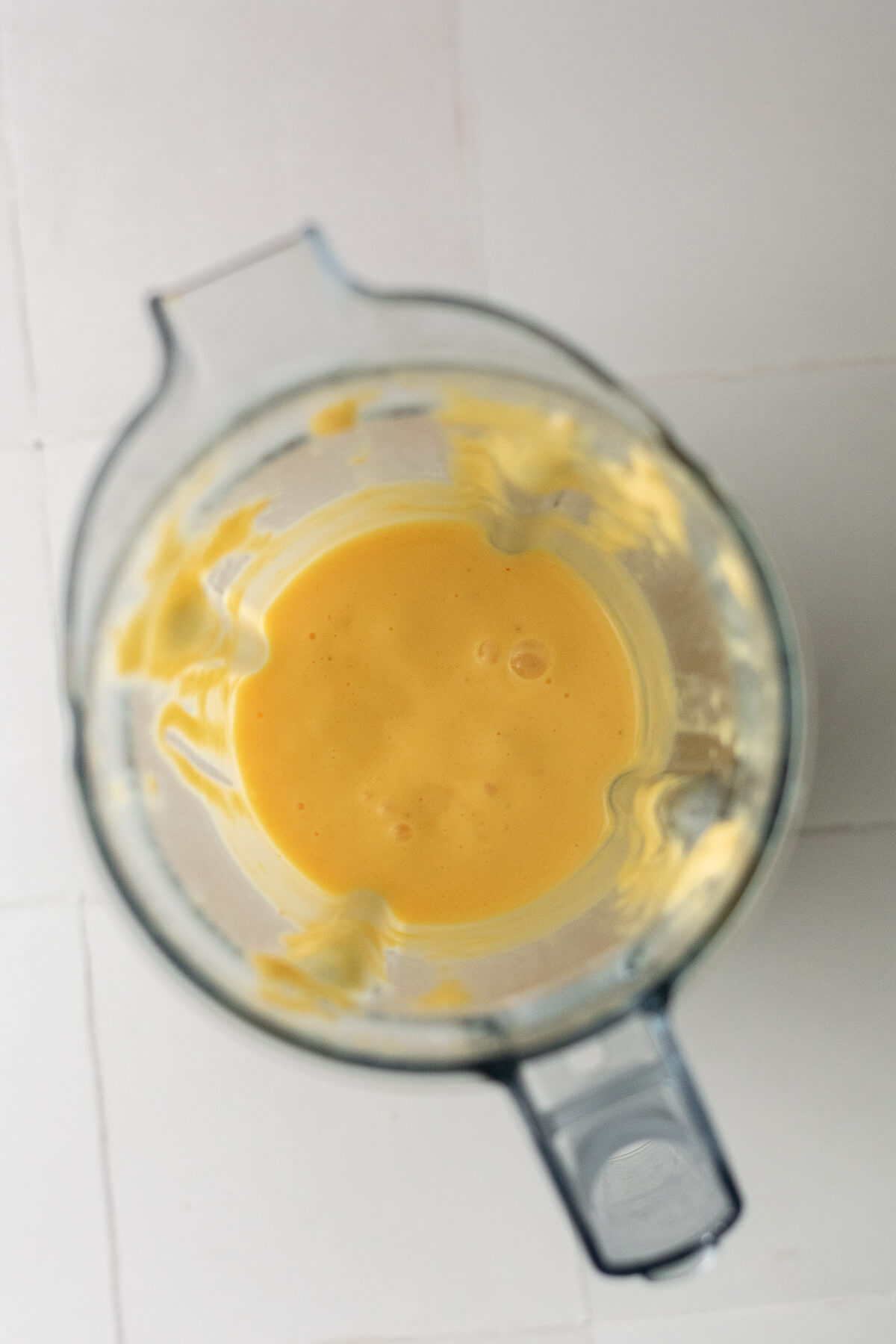 blended mango lassi in a jug